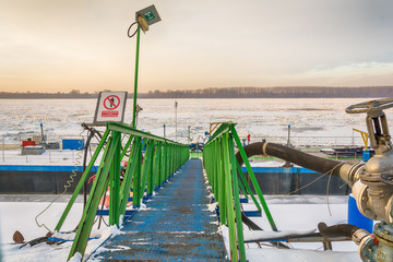 Naklejka premium Belgrade, Serbia January 12, 2017:A big river boat on the frozen Danube in Belgrade