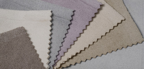 Bright collection of velour textile samples. Fabric texture background.
