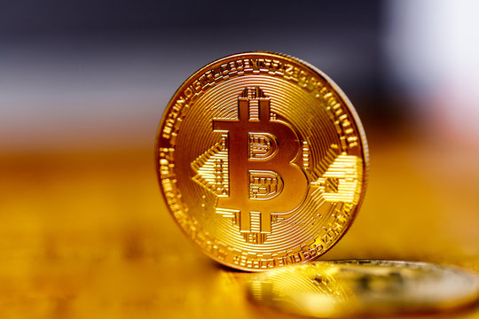 Bitcoin. Gold Bitcoin on grey background.(new virtual money)