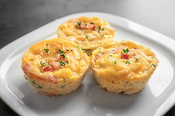Plate with tasty egg muffins, closeup