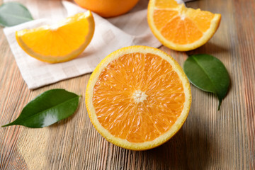 Fresh sliced orange on wooden table