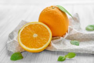 Fresh oranges on wooden table