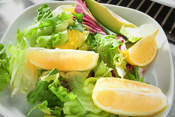 Bowl with delicious fresh salad, closeup