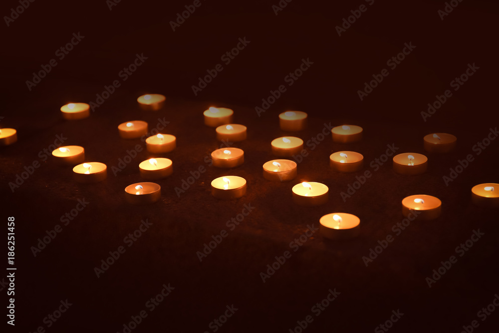 Canvas Prints Lots of burning candles in darkness