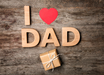 Creative composition for Father's Day on wooden background