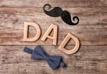 Creative composition for Father's Day on wooden background