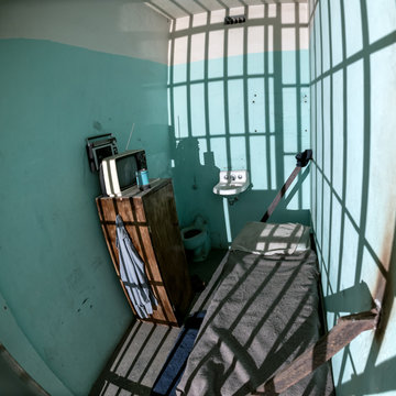 Single death row jail cell with TV and bed