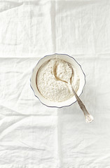 Organic wheat flour in a ceramic bowl