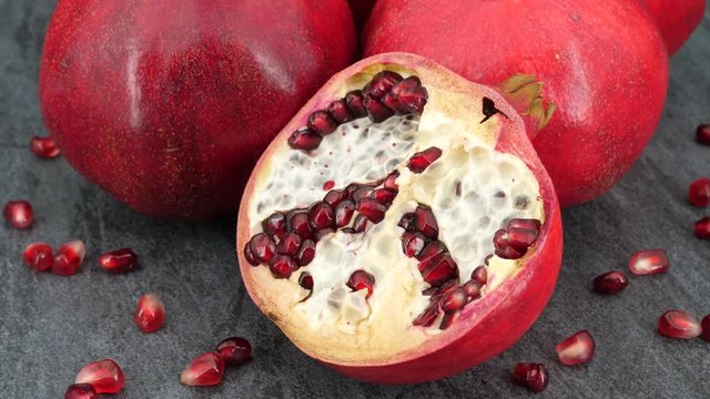 Rotating pomegranate fruit, top view, 4K.
