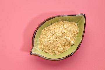 maca root powder in a leaf bowl
