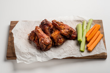 Buffalo chicken wings on white food background isolated.