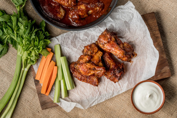 Buffalo chicken wings cooking. Food background.