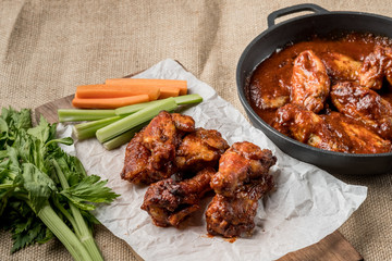 Buffalo chicken wings cooking. Food background.