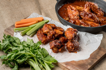 Buffalo chicken wings cooking. Food background.