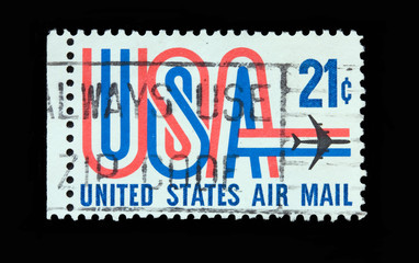 USA 21 cent air mail postage stamp with the writing USA in 3 colors
