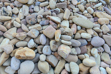 Close up of rounded and polished beach rocks