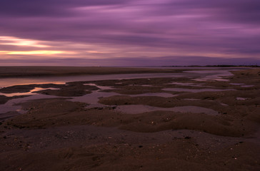 Dramatic sky during sunset at Sandy Hook Bay in New Jersey