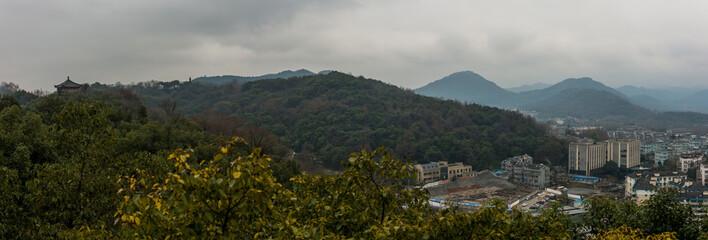 panorama cityscape in hangzhou from a vantage point  in a cloudy day