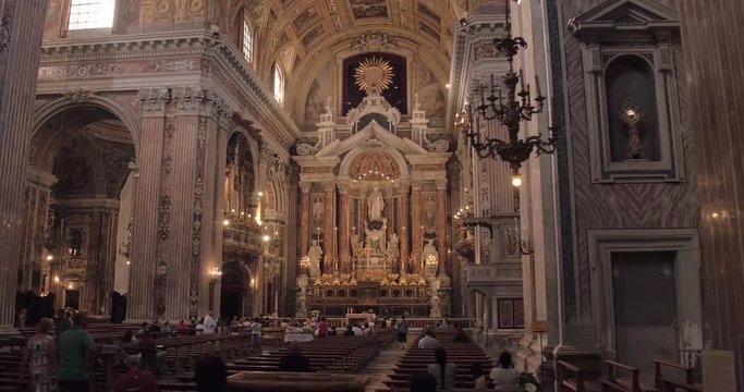 NAPLES, ITALY &ndash; JULY 2016 : Video shot of Church of Ges&ugrave; Nuovo interior on a sunny day with statues and people in view