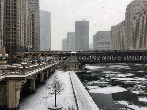 View of snow-covered riverwalk on a frigid winter morning in Chicago as temperatures start to plunge.