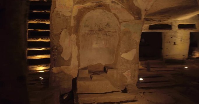 NAPLES, ITALY &ndash; JULY 2016 : Video shot in Catacombe di Napoli / Naples Catacombs with lights and carvings in view