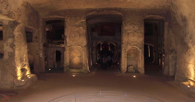 NAPLES, ITALY &ndash; JULY 2016 : Video shot in Catacombe di Napoli / Naples Catacombs with peopl and carvings in view