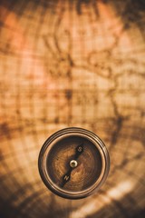 Closeup of an Old Compass on an Old Map