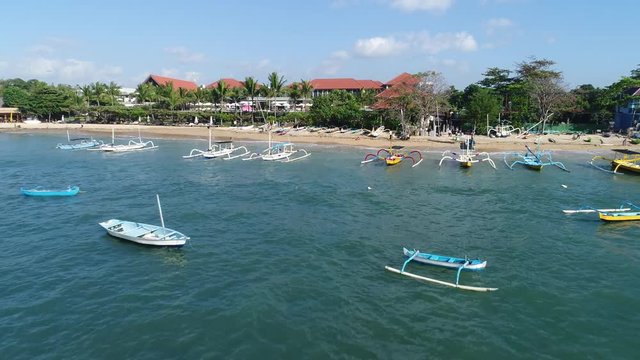 Stock Aerial footage of Sanur Beach, on Bali, Indonesia has many of these interesting boats