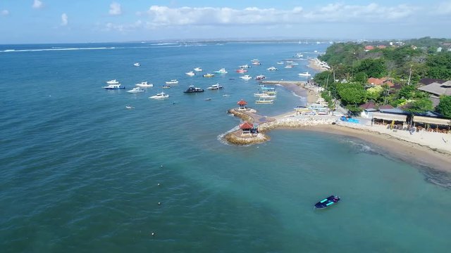 Stock Aerial footage of Sanur Beach, on Bali, Indonesia has many of these interesting boats