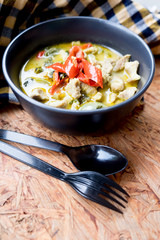 Thai spicy green curry with pork and coconut milk