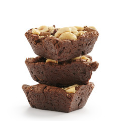homemade heart shaped chocolate cookies with hazelnuts and chocolate pieces isolated on white