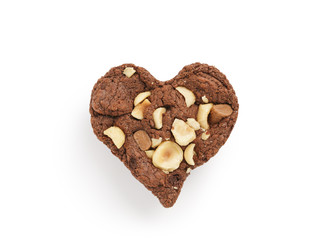 homemade heart shaped chocolate cookies with hazelnuts and chocolate pieces isolated on white