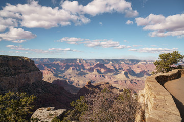 view from South Rim of Grand Canyon in sunny autumn day with white clouds