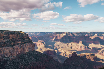 view from South Rim of Grand Canyon in sunny autumn day with white clouds