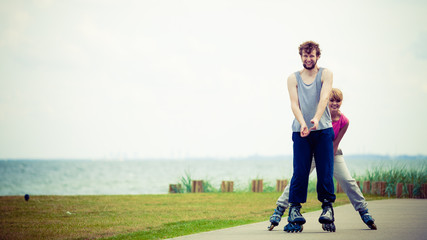 roller skater couple skating outdoor