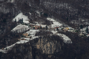 colorful houses on the slope of a snowy mountain