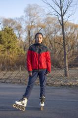 Portrait of roller skating sporty girl in park. Woman roller skating sport activity.