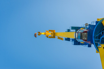 Large cranes working to unload a cargo ship in the dock