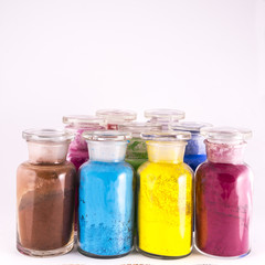 Fototapeta na wymiar glass containers containing natural colored pigments in powder