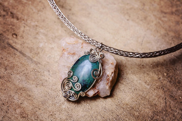 Beautiful gemstone necklace detail with natural background