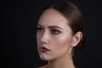 Fototapeta premium Woman with make-up on one side of the face and without make-up on the second side of the face. Beauty concept.