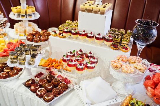 Great variety of different multicolored snacks on the wedding buffet.