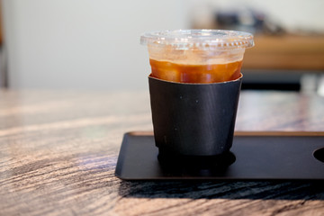 Plastic cup of iced black coffee