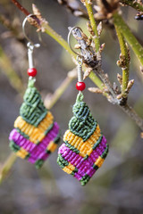 Romantic earrings hanging on natural background