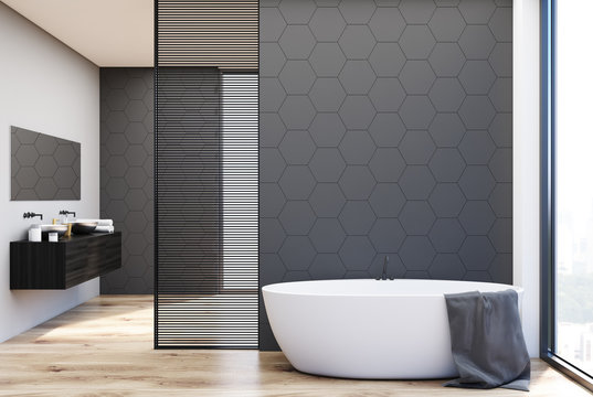 Gray tile bathroom, tub and sinks