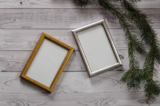 Two frames for photos on a light, vintage wooden background