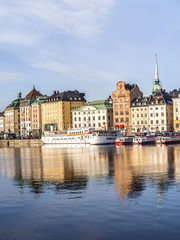 Fototapeta na wymiar Stockholm daylight skyline panorama of Gamla Stan with white ships