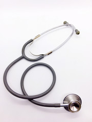 Medication concept, gray stethoscope is isolated on white background with clipping path.