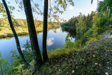 high water level in river Gauja, near Valmiera city in Latvia. summer trees surrounding