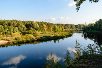 Fototapeta na wymiar high water level in river Gauja, near Valmiera city in Latvia. summer trees surrounding